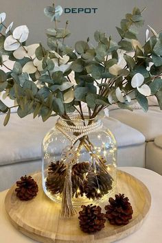 a vase filled with flowers sitting on top of a table