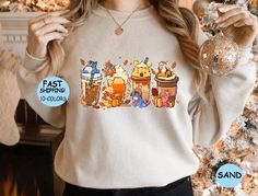 Embrace the whimsical charm of Disney with this delightful Winnie The Pooh Coffee Latte Shirt. Inspired by everyone's favorite honey-loving bear, this cozy sweatshirt hoodie features a vintage Fall season design that is perfect for autumn and Halloween. Whether you're a Disney fan, a coffee lover, or just looking for a fun and unique sweater to add to your fall wardrobe, this shirt is a must-have!

Disney, Winnie The Pooh, Coffee Latte Shirt, Sweatshirt Hoodie, Vintage Fall Season Sweater, Fall Coffee Shirt, Halloween Pumpkin, Cozy, Whimsical, Honey-Loving Bear, Autumn, Halloween, Coffee Lover, Disney Fan, Fun, Unique, Sweater, Fall Wardrobe, Delightful, Charming, Whimsical, Vintage Design, Honey Bear, Disney Character, Coffee Cup, Fall Colors, Pumpkin Spice, Cozy Sweatshirt, Hooded Sweate Dtf Image, Polyester Sweater, Fall Attire, Sweatshirt Graphic, Coffee Tees, Pumpkin Sweatshirts, Coffee Sweatshirt, Unique Sweaters, Monochrome Outfit