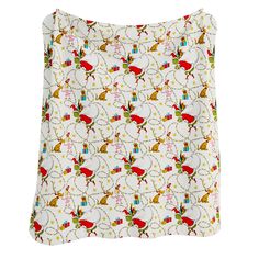 a white pillow with red and green reindeers on it's side, in front of a white background