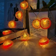 an assortment of orange lights on a table