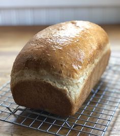 a loaf of bread sitting on top of a cooling rack