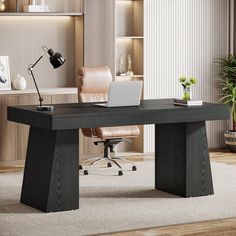 an office desk with a laptop on it