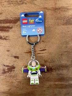 a toy story keychain with buzz lightyear on it