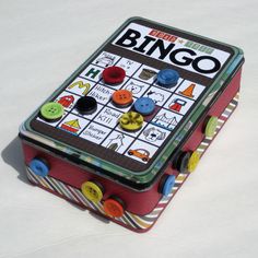 a red and green box with buttons on it