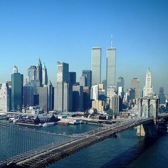 an aerial view of the brooklyn bridge and lower manhattan