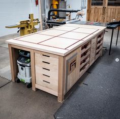 a workbench made out of plywood and wood