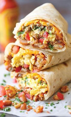 two burritos are stacked on top of each other