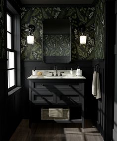 a bathroom with black and green wallpaper, two sinks and a mirror on the wall