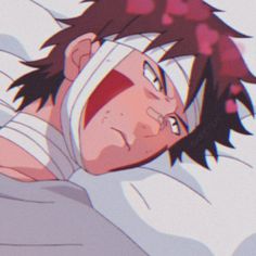 an anime character laying in bed with his eyes closed