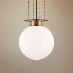 a white light hanging from a ceiling fixture