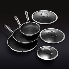 an assortment of cookware on a black background