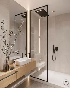 a bathroom with two sinks and a shower