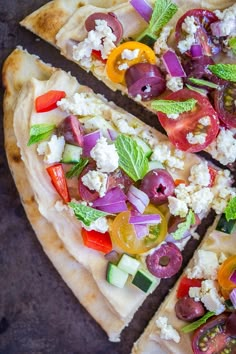 two slices of flatbread pizza with vegetables and feta cheese