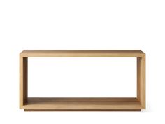 a wooden shelf sitting on top of a white wall in front of a white background