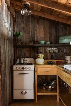 an old fashioned stove in a rustic kitchen