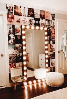 there is a large mirror with lights on it in the room and an image of a bedroom