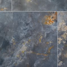 three different pictures of marble with yellow and gray paint on it's sides,