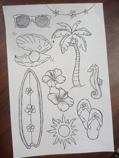 a piece of paper that has some drawings on it, including palm trees and beach items