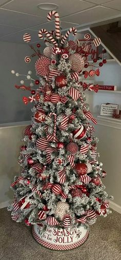 a christmas tree decorated with red and white ornaments