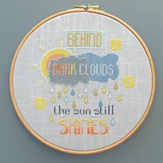 a cross stitch pattern with words and rain drops