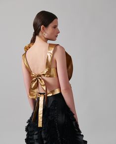 The SAXO is an opulent shirtfront delicately hand crafted from a smooth and luxurious metallic fabric to create an oversized statement flower. Starting along the shoulder the fabric blooms throughout the body, dwindling at the waistline, creating an impressive design, synonymous with the brand. The SAXO is enhanced with an open back and two tie straps for closure. #html-body [data-pb-style="62FB5CA891425"]{justify-content: flex-start; display: flex; flex-direction: column; background-position: l Designer Ruffled Tops For Evening, Top Background, Cover Background, Metallic Fabric, Fall Coat, Shoes Heels Boots, White Shirt, Open Back, Backless Dress