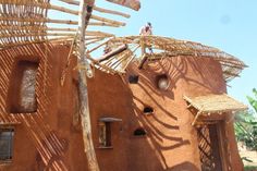 a house made out of clay and bamboo