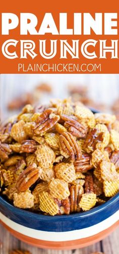 a blue bowl filled with pecans on top of a wooden table