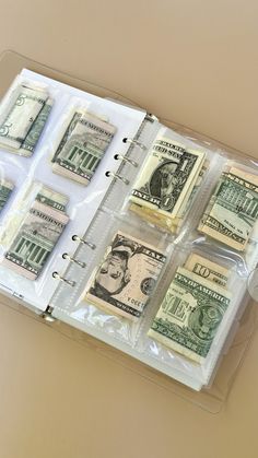 several bundles of money are in a clear plastic case