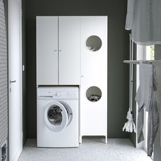 a white washer sitting next to a dryer in a room