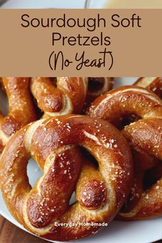 some pretzels are on a white plate with the words sourdough soft pretzels no - yeast