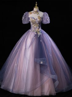 Begin a new chapter in a dress that speaks with the gentle whisper of a butterfly's wings. The multi-tonal tulle of this Quinceanera gown fans out in a spectrum of purples, from the deepest lilac to the faintest lavender, reminiscent of the delicate dance of butterflies over a meadow. The bodice, rich with golden and silver embroidery, brings forth an image of these graceful creatures alighting on flowers, their beauty captured in every stitch. With sheer sleeves and floral accents that mirror nature's own design, this dress is a testament to the transformative journey of a young woman coming into her own, as mesmerizing and unique as a butterfly's path through the skies. Ball Gowns Light Purple, Gown Purple, Purple Quinceanera Dresses With Sleeves, Fairy Flowy Dress, Purple Princess Dress Fairytale, Tangled Dress Prom, Elegant Dresses Purple, Purple Tulle Ball Gown, Night Dresses Party