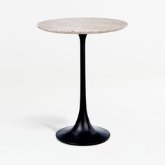 a white marble table with black base on a white background in the shape of a cone