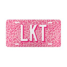 pink leopard print license plate with the letter kt