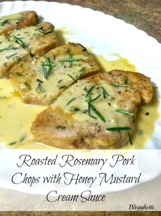 roasted rosemary pork chops with honey mustard cream sauce on a paper plate, ready to be eaten