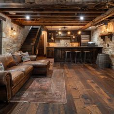 a living room filled with furniture next to a wooden floor covered in lots of wood