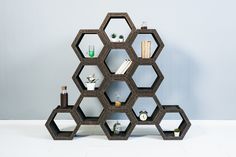 an unusual shelving unit with hexagonal shelves