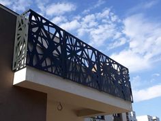 the balcony railing is designed to look like an intricate design