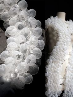 two photographs of white flowers on a mannequin's torso, one is wearing a dress with ruffles and the other has buttons