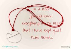 a red string with a silver heart on it and a poem written in the middle