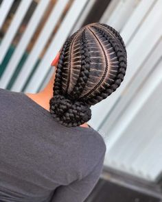 15 Best Protective Hairstyles Black Women Are Getting Right Now Feed In Braids In A Bun, Cornrow Updo Hairstyles Buns, 4 Braids Into Bun, Six Cornrows Braids, Feed In Braid Bun, 4 Feed In Braids Hairstyles With Bun, 6 Feed In Braids Hairstyles, Cute Cornrows, Cornrows Natural