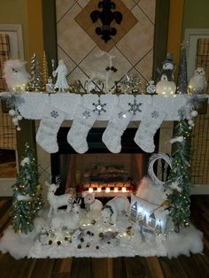 a mantel decorated with stockings and christmas decorations