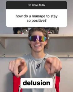 a man wearing sunglasses with the caption delusion on his face and pointing at him