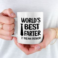 a woman holding a coffee mug with the words world's best father on it