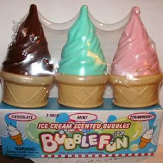 three ice cream cones are in a box