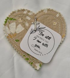 a heart shaped card with a cross on it