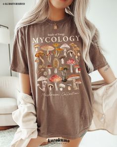 This Unisex garment-dyed t-shirt features "Study of Fungi | Mycology | Mushroom Collection" with a lovely set of watercolor mushroom illustrations. It is the perfect gift for present / future mycologists, science teachers, mushroom foragers & more! Make sure to check out the other garment options below :) » O P T I O N S « ‣ Crewneck: https://www.etsy.com/listing/1700683435 » A B O U T « ‣ This item is made to order using direct-to-garment (DTG) printing technology. This digital process involves Clothes Mushroom, Mushroom Outfit, Mushroom Illustrations, Girl Camping, Watercolor Mushroom, Mushroom Cottagecore, Camping Clothes, Science Gifts, Camping Outfits