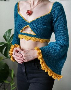 a woman wearing a blue and yellow crop top