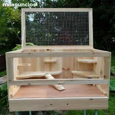 a chicken coop built into the back of a wooden bench