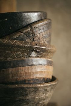 several wooden bowls stacked on top of each other