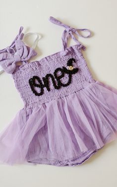 Beautiful one romper for your little Halloween babe. This listing is for a purple romper, one lettering in black and a witch hat appliqué next to it.  Halloween Birthday Spooky Birthday  Birthday photoshoots, special events, etc. If you'd like a different color or saying, don't hesitate to contact us Spooky One First Birthday Outfit, Spooky One First Birthday Girl Outfit, One Spooky Babe Birthday, Spooky One First Birthday, Spooky Birthday, Halloween First Birthday, Birthday Romper, Spooky One, Witch Hat Halloween